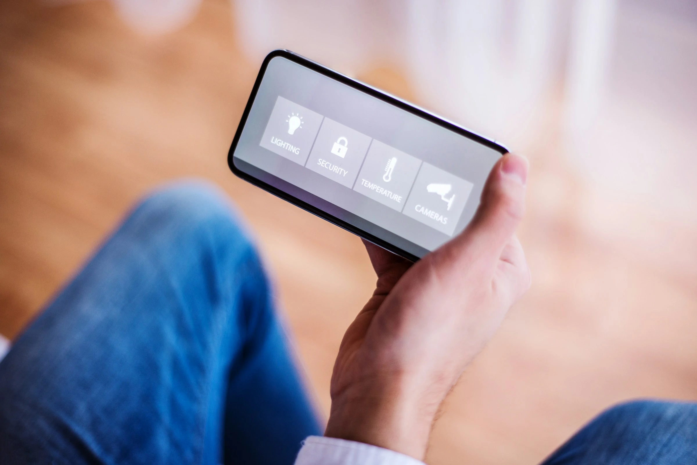 Person using smart home security app on phone